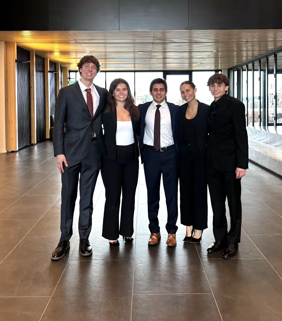 with classmates before a business competition