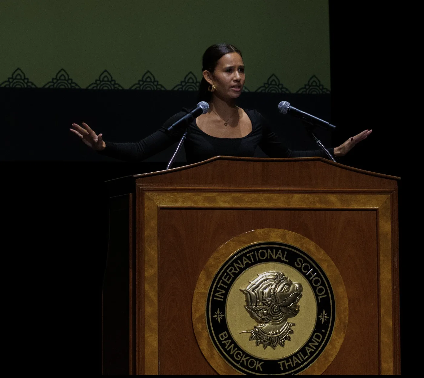 speaking at a podium at international school bangkok