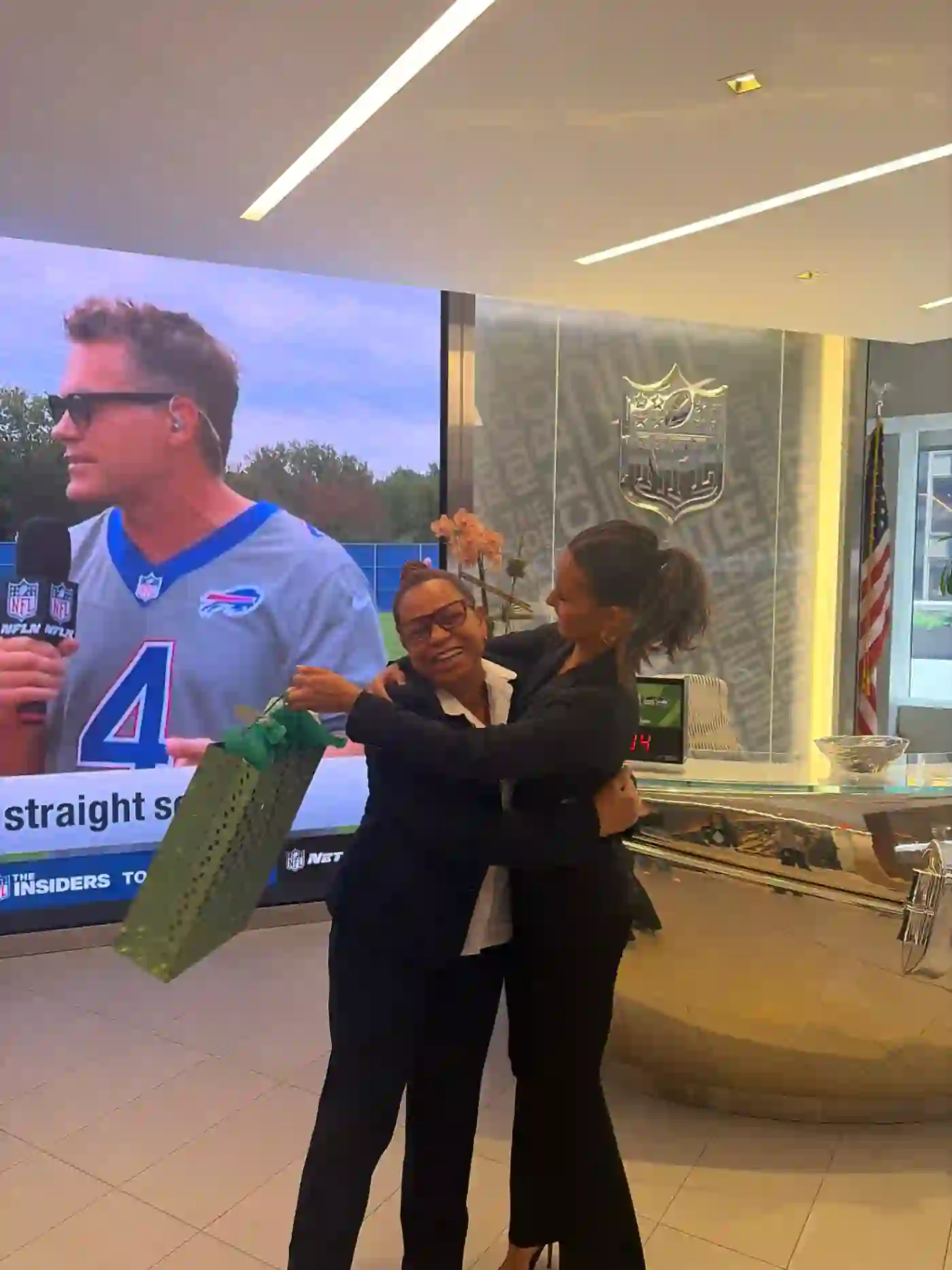 hugging a colleague at the nfl office